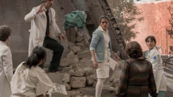 Every Minute Counts TV show screenshot 2: Dr. Ángel Zambrano and Nurse Chave climb with others over rubble at the hospital.
