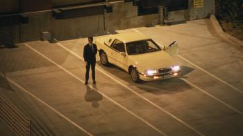 Everybody's Live with John Mulaney TV show screenshot 2: Mulaney stands next to his car