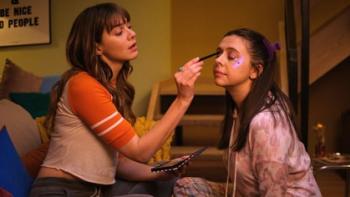 Everything I Know About Love: Emma Appleton does Bel Powley's makeup on their living room couch.