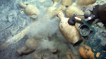 Removing an ancient vessel from a wreck. 