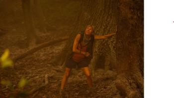 Extrapolations: A woman (Sienna Miller) rests against a tree in the forest