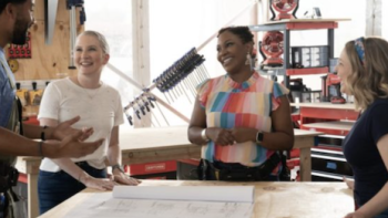 Extreme Makeover: Home Edition (2025) screenshot 1: Wendell, Clea, Arianne, and Joanna stand around table looking at building plans. 