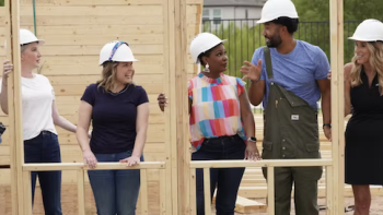 Extreme Makeover: Home Edition (2025) screenshot 2: Clea, Joanna, Arianne, Wendell, and Taylor Morrison CEO hold on to a house frame.