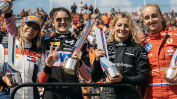 F1: The Academy TV show screenshot 3: Podium winners stand together holding trophies.