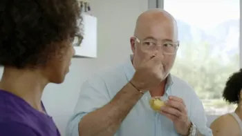 Family Restaurant TV Show: host Andrew Zimmern tastes a spoonful of food