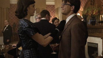 Fellow Travelers TV show screenshot 2: Mary Johnson adjusts Tim's tie at party.