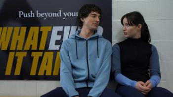 Finding Her Edge: Freddie and Adriana sit together on a bench having a conversation; Adriana looks to be discomfited