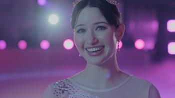 Finding Her Edge: Adriana is shown in closeup on the ice, smiling joyously in a skating costume