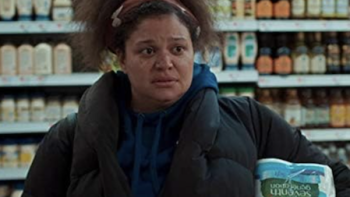 First Wives Club TV show screenshot 2: Exhausted Bree stands in supermarket holding toilet paper. 