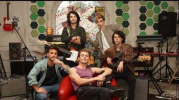 Freeks TV show screenshot 4: Freeks band members stand in studio posed with their instruments.. 