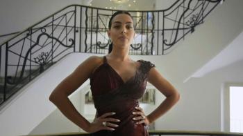 I am Georgina TV Show: Georgina poses in a dress.