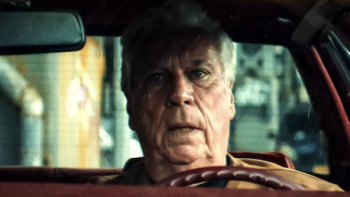 Get Gotti TV show screenshot 3: Frank O'Hara sits in driver side of car.  