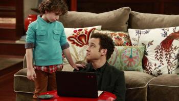 Girl Meets World: Auggie and Cory sitting in front of the couch 