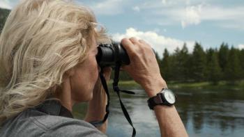 Gold and Greed: The Hunt for Fenn's Treasure: A woman looking through googles in the wilderness