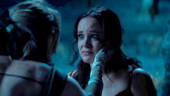 Grosse Pointe Garden Society TV screenshot 2: AnnaSophia Robb holds Melissa Fumero’s face in her hands. 