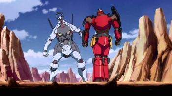 Gurren Lagann TV Show: Two large robots stand ready in a rocky desert landscape under a blue sky with scattered clouds.