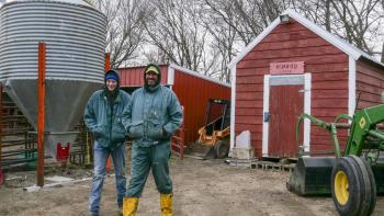 Heartland Docs DVM screenshot: A white man and woman stand near a red shed