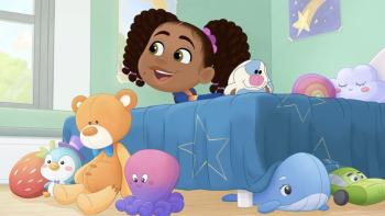 Hey A.J.! TV show screenshot 3: A.J. is on her bed playing with her stuffed bunny, other stuffed animals hang around the bed on the floor.