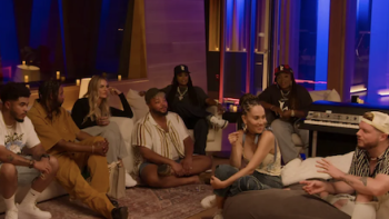 Hitmakers TV show screenshot 3: Songwriters together in a studio talking.