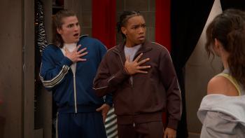 Hollywood Arts TV show screenshot 3: Martin Kamm and Peyton Jackson stand with their hands to their chests. They wear sweatsuits.