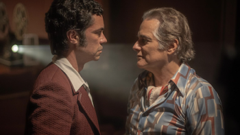 Hotel Cocaine screenshot 3: Roman Compte and Yul Velazquez stand closely and are face to face. 