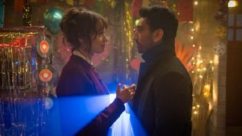 How to Get to Heaven from Belfast TV show screenshot 2: Owen and Greta are shown facing each other in a club with colored lights