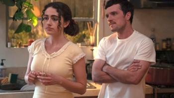 I Love LA TV show screenshot 2: Maia and Dylan stand together in their apartment, each has crossed arms and a bemused expression