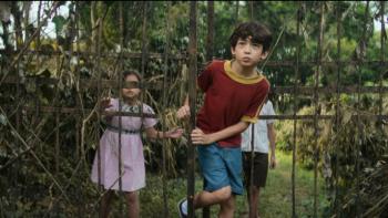 I'm Not Afraid TV show screenshot 2: the kids run through the forest