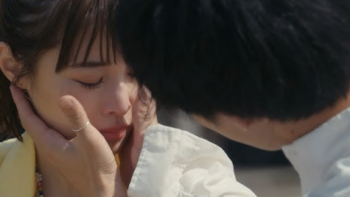 Is She the Wolf? screenshot 3: A man strokes a female cast member's face. 