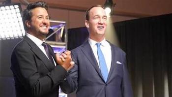 It's All Country: Two of the cast members shake hands. 