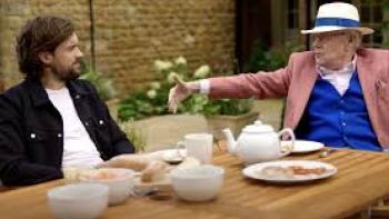 Jack Whitehall: Fatherhood with My Father TV show screenshot #1: Father and son sit at a dining table outside