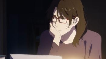 Journal with Witch TV show screenshot 3: Maiko sits in the dark with her laptop, staring off in the distance thoughtfully