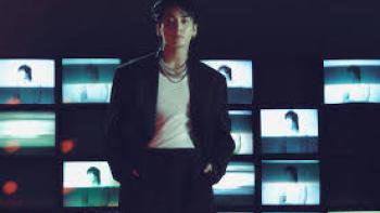 Jung Kook: I Am Still TV show screenshot #2: Jung Kook stands in front of lit images