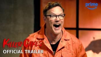 Host Matthew Lillard in a splattered, dirty orange jumpsuit with mouth open in excited horror.