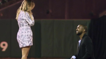 Kim vs. Kanye: The Divorce TV show screenshot 1: Kanye proposes to Kim in a stadium. 