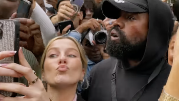 Kim vs. Kanye: The Divorce TV show screenshot 2: Kanye in crowd while young woman takes selfie with him.