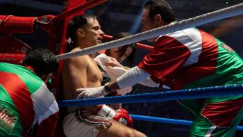 Gael García Bernal sits in the corner of a boxing ring as Andrés Delgado towels him off. Jorge Perugorria tightens his boxing gloves.