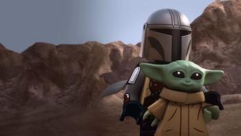 Lego Star Wars: The Mandalorian TV show screenshot: Mandalorian carries Grogu