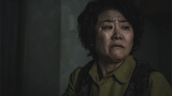 Light Shop TV show screenshot 3: A woman with short, dark hair is shown from the shoulders up, looking to the side with a pained and upset expression