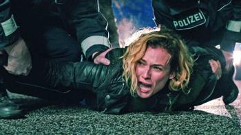 Little Disasters TV show screenshot 3: Police on either side of Jess hold her down on the pavement as she shrieks in despair