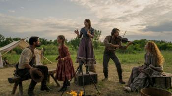 Little House on the Prairie TV show: Charles plays his fiddle as the Ingalls family members listen and sit on the prairie