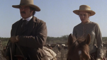 Lonesome Dove TV show screenshot 2: Jake Spoon and Lorena Wood riding horses. 