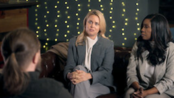 Love Con Revenge TV show screenshot 4:  Cecilie Fjelljoy and Brianne Joseph talking to a scam victim. 