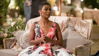 Love in Fairhope screenshot 2: a Black woman sits in a floral dress