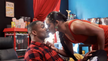 Love & WWE TV show screenshot 2: Standing Bianca kisses sitting Montez.