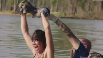 Luanne & Sonja: Welcome to Crappie Lake TV show screenshot 3: LuAnne surfaces lake with catfish in her hands.