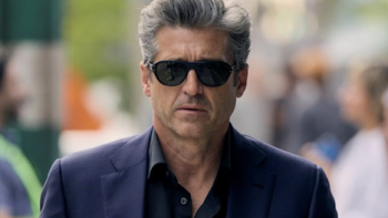 Memory of a Killer TV show screenshot 1: Angelo Doyle in black suit and dark sunglasses. 