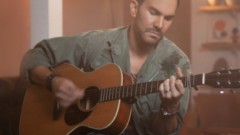 Playing guitar. 