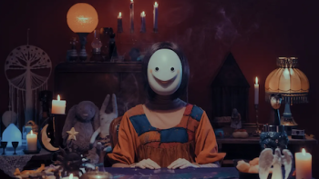 Million-Follower Detective TV show screenshot 2: Witch Baba in a white mask and orange and black blouse.