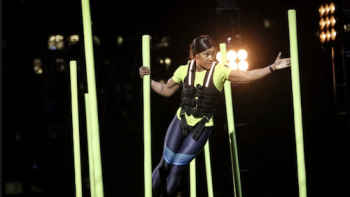 Million Dollar Mile TV Series: A competitor pushes through an obstacle course. 